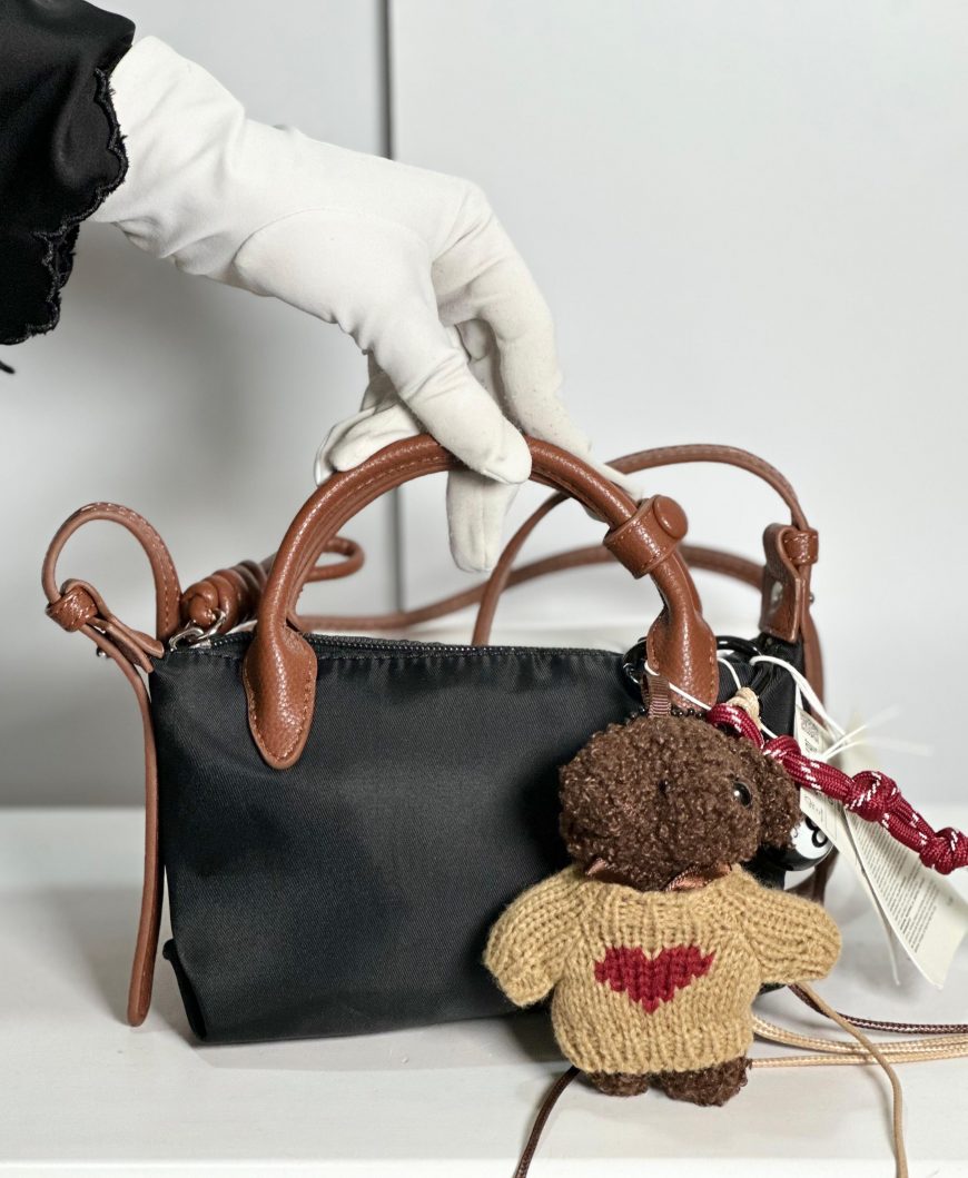 Reserved bag with charm