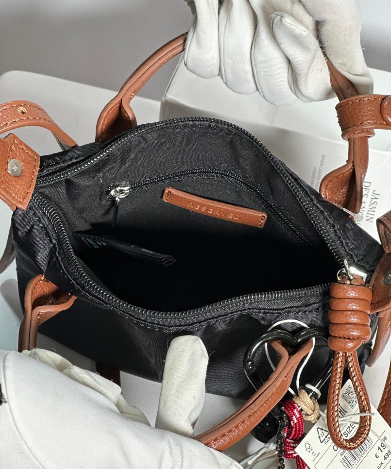 Reserved bag with charm